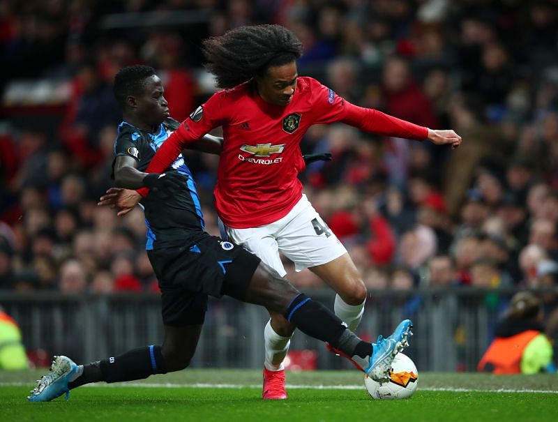 Tahith Chong of Manchester United battles for possession with Krepin Diatta of Club Brugge